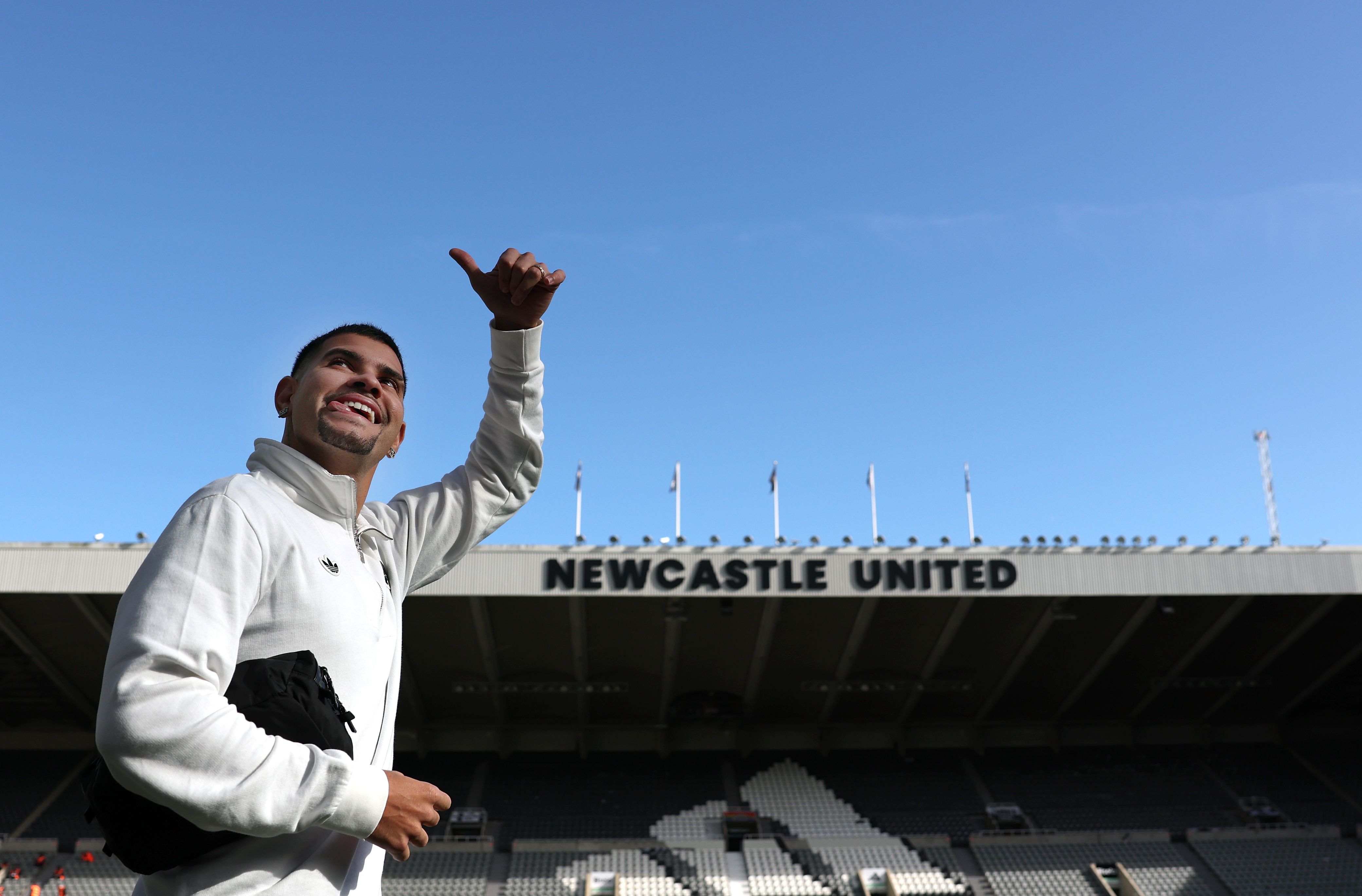 Bruno Guimaraes gives a wave as he arrives at the ground prior to the Premier League match between Newcastle United and Nottingham Forest at St James Park (Photo by Stu Forster/Getty Images)