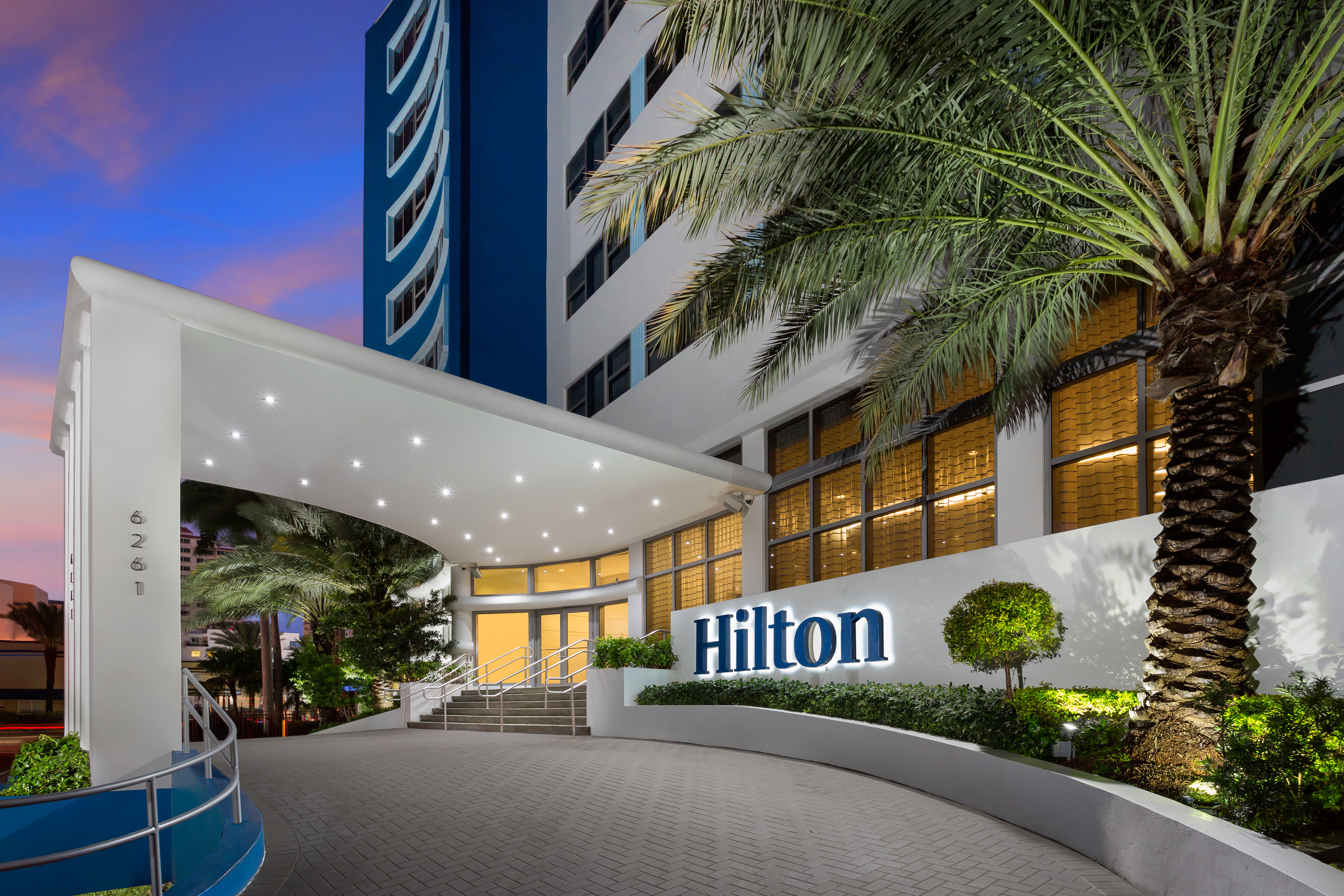 Hilton Hotels exterior canopy at dusk