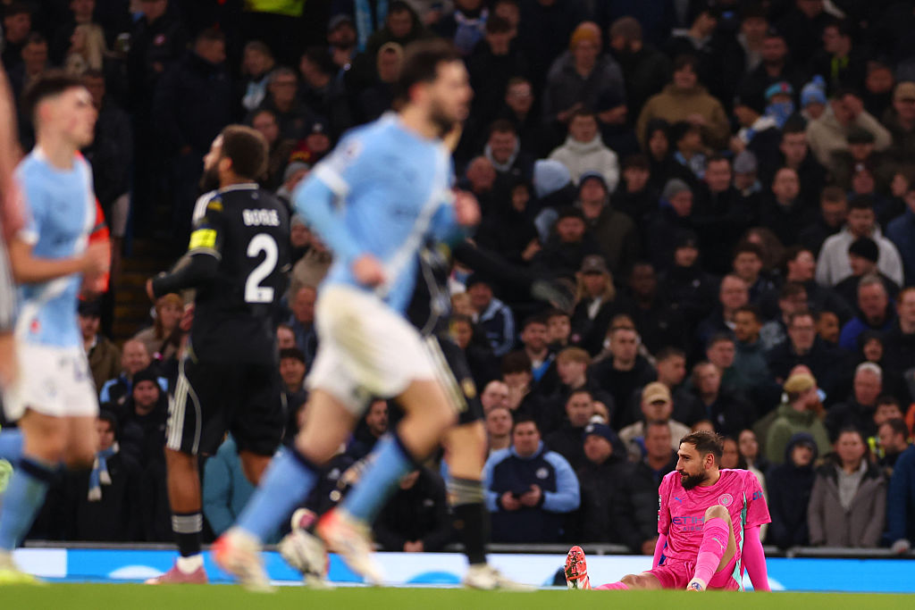 Gianluigi Donnarumma goes down with a supposed injury against Leeds