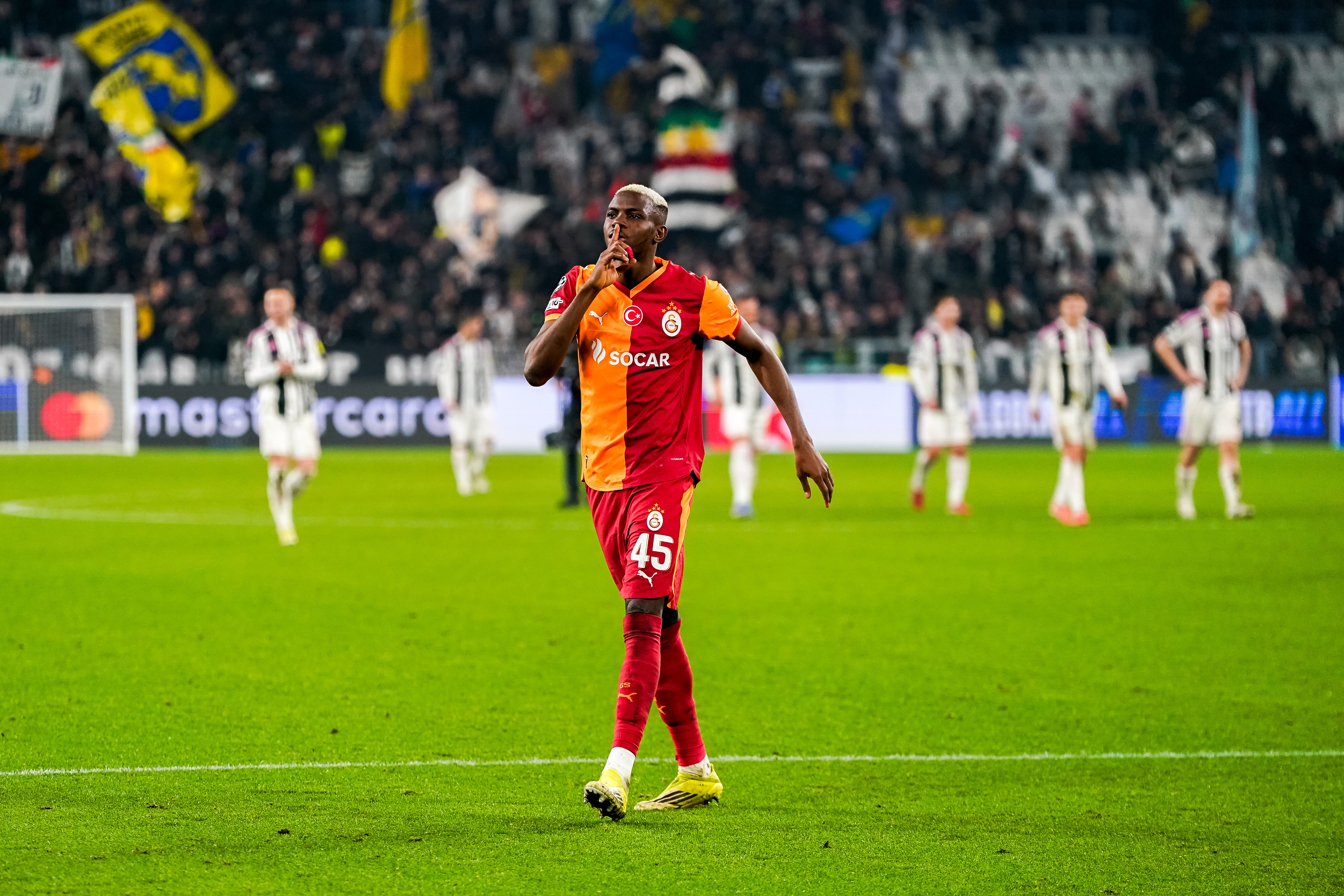 Victor Osimhen, of Galatasaray, greets fans at the end of the UEFA Champions League round of 16 play-off second leg match between Juventus and Galatasaray at the Juventus Stadium in Turin, Italy