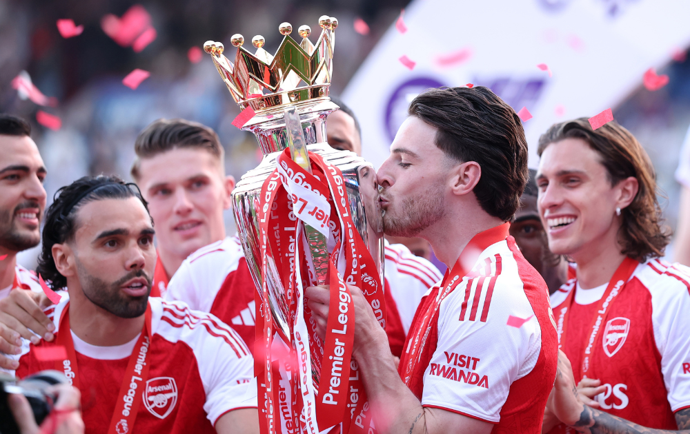Declan Rice of Arsenal kisses the Premier League Trophy after their team's victory in the Premier League match between Crystal Palace and Arsenal at Selhurst Park on May 24, 2026 in London, England.