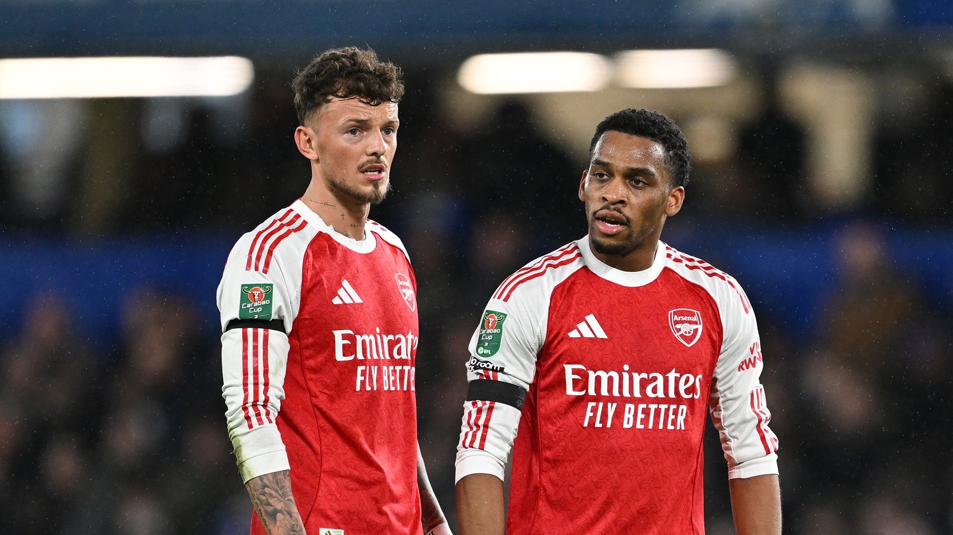 Ben White of Arsenal and Jurrien Timber of Arsenal speak during the Carabao Cup semi-final first-leg match between Chelsea and Arsenal at Stamford Bridge on January 14, 2026, in London, England.