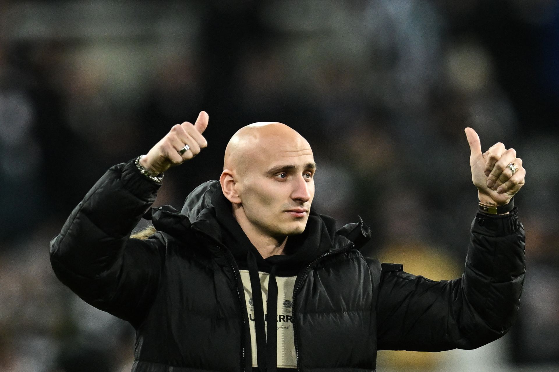 English midfielder Jonjo Shelvey salutes Newcastle United's fans as he prepares to leave the club for Nottingham Forest, during the English League Cup semi final football match between Newcastle United and Southampton at St James's Park stadium in Newcastle, on January 31, 2023. (Photo by Paul ELLIS / AFP) / RESTRICTED TO EDITORIAL USE. No use with unauthorized audio, video, data, fixture lists, club/league logos or 'live' services. Online in-match use limited to 120 images. An additional 40 images may be used in extra time. No video emulation. Social media in-match use limited to 120 images. An additional 40 images may be used in extra time. No use in betting publications, games or single club/league/player publications. / (Photo by PAUL ELLIS/AFP via Getty Images)