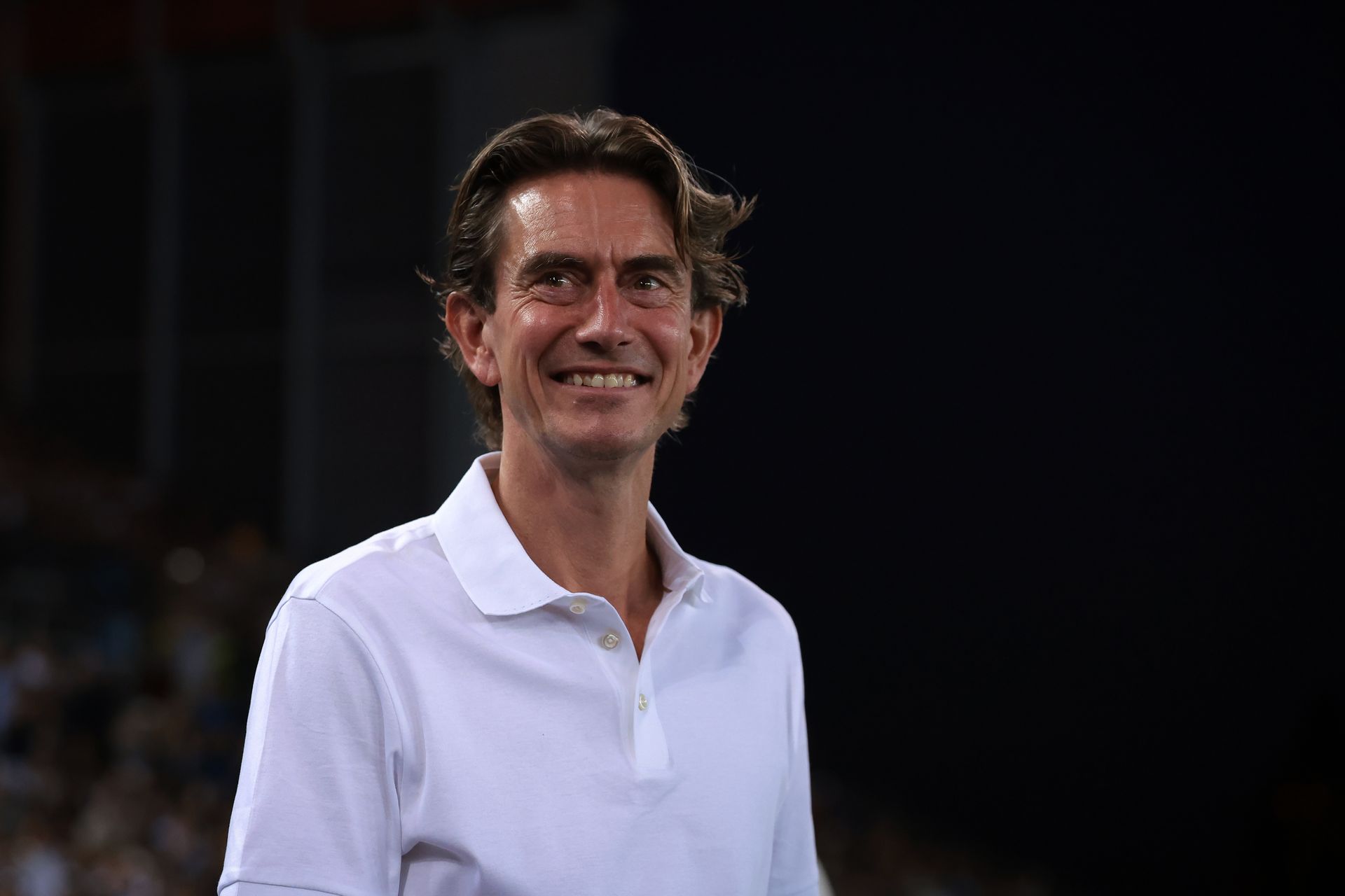 Thomas Frank smiles during Spurs' UEFA Super Cup encounter with PSG