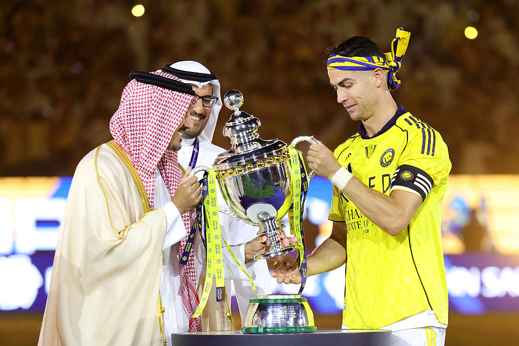 Cristiano Ronaldo of Al Nassr being presented with the Saudi Pro League Trophy. (Photo by Abdullah Ahmed/Getty Images)