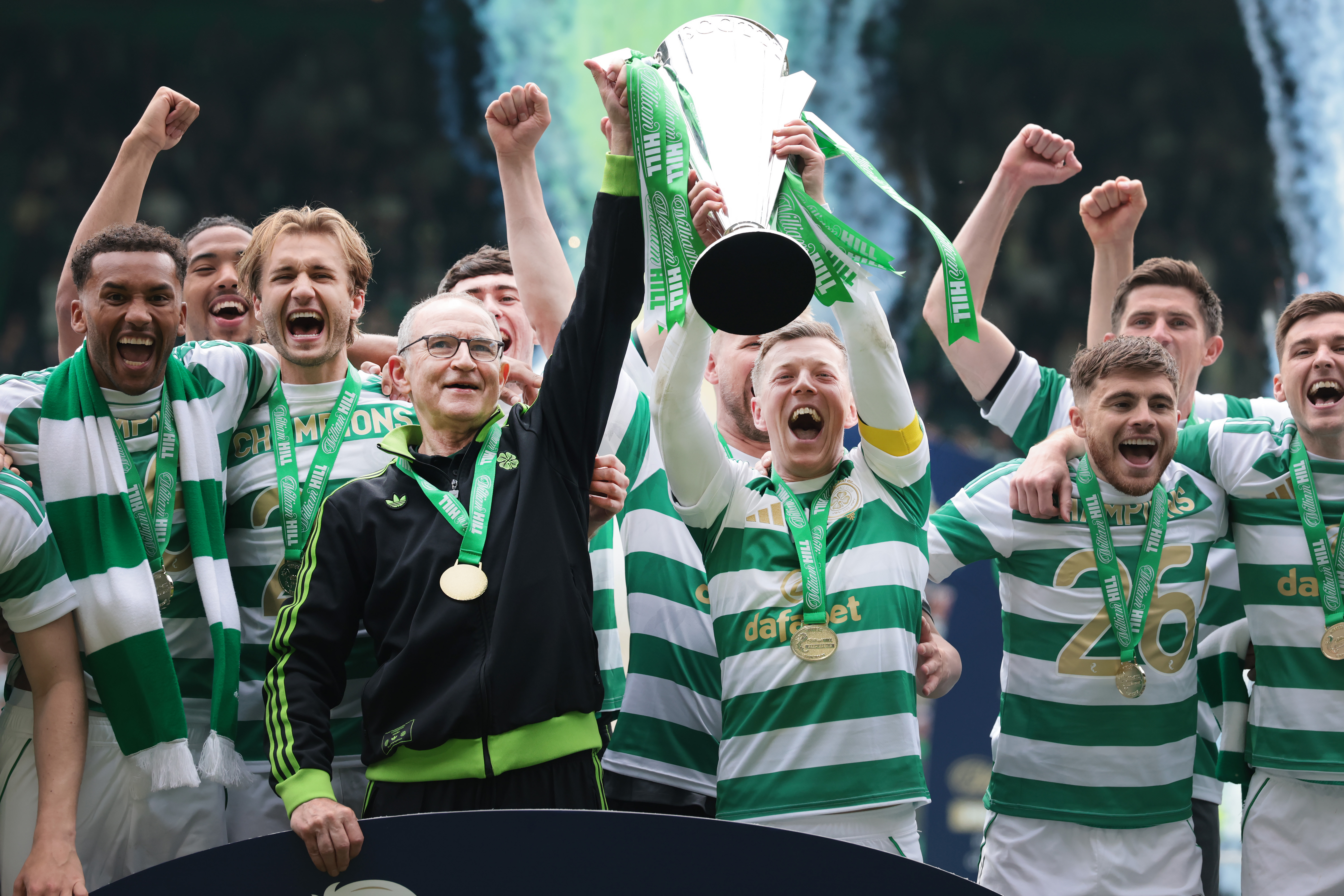 Celtic team and their manager lifting the SPL trophy.