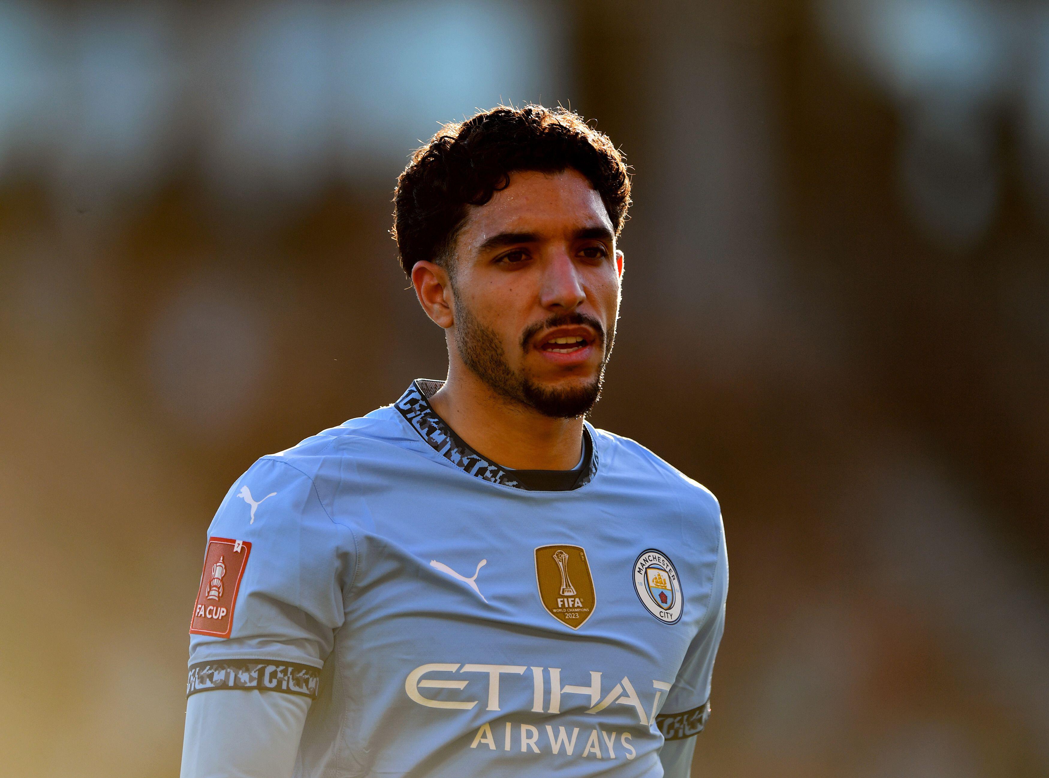 Omar Marmoush of Manchester City looks on during the FA Cup quarter-final against AFC Bournemouth. Walking, side profile, mid shot.